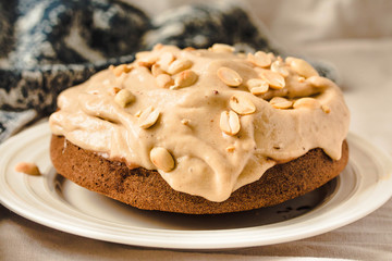 Cream Snickers Pie. Chocolate Sponge Cake filled with whipped cream and peanuts.