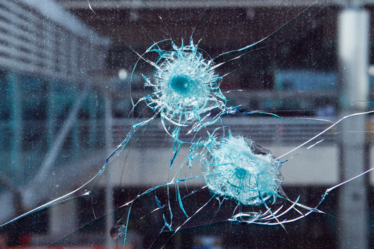 Bullet hole in glass.