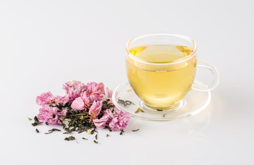 Cup of tea and sakura blossom.