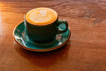 Ceramic Cup Of Cappuccino On Wooden Table With Copyspace
