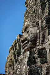 Beautiful face sculptures at the famous Bayon temple in the Angkor Thom temple complex, Siem Reap, Cambodia