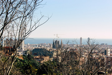 View of Sagrada Familia and port from Park Guell. Barcelona, Spain.