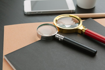 Modern workplace on a black table top view