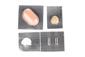 Silver blister packs pills isolated on white