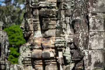 Beautiful face sculptures at the famous Bayon temple in the Angkor Thom temple complex, Siem Reap, Cambodia
