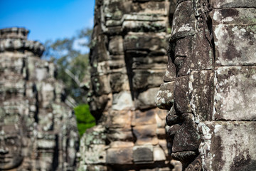 Beautiful face sculptures at the famous Bayon temple in the Angkor Thom temple complex, Siem Reap, Cambodia