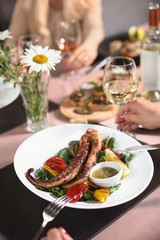 Pulpo cocido. grilled octopus and vegetables on a wooden table, terrace. seafood, Fish dish. Fresh food.