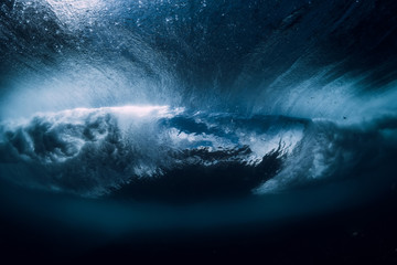 Barrel wave underwater with air bubbles. Ocean in underwater