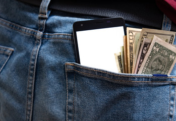 Money and phone stick from the back pocket of jeans