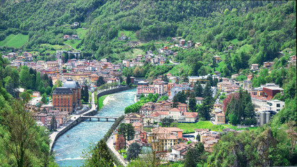 Fototapeta na wymiar The brembo river crosses the tourist resort of the brembana valley San pellegrino terme