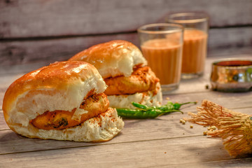 Vada Pav Vada Pav is Mumbai's most popular street food! Spicy potato filling is sandwiched between burger buns and layered with spicy chutney!
