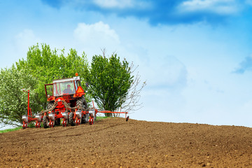 Tractor with mounted crop seeder