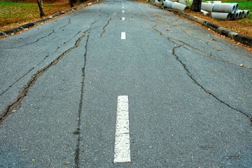 Fototapeta premium Broken Asphalt Road Background.