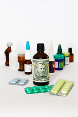 dollar on a bottle of medicine on the background of medical drugs