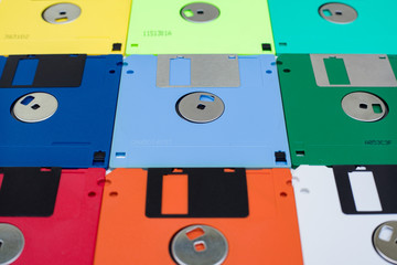 Multi colored 3.5 floppy disks in foreshortening