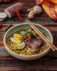 Mee rebus or malaysian boiled noodles in sweet potato gravy