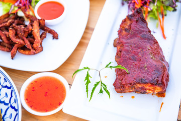 Grilled pork topped with sauce