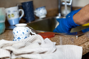 Washed tea cup stands in front of sink