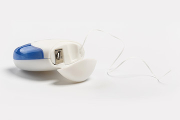 New dental floss isolated on a white background.