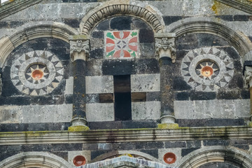The Basilica della Santissima Trinità di Saccargia (Basilica of the Holy Trinity), a romanesque church in northern Sardinia, Italy. Entirely built with local black basalt and  limestone.