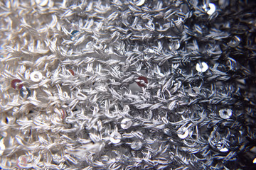 Knitted texture of fabric with sequins