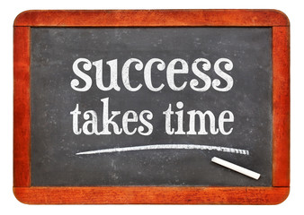 Obraz premium success takes time inspirational text on blackboard