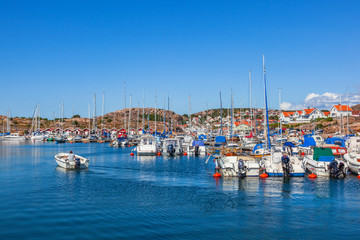 Fototapeta na wymiar Coastal view with a marina and boats in the Swedish archipelago