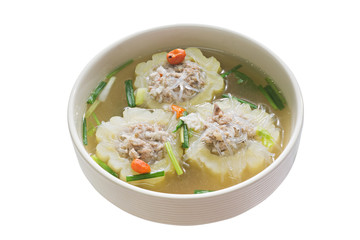 Stuffed bitter gourd with seasoned minced pork soup in White bowl isolated on white background, selective focus (detailed close-up shot)