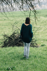 stylish beautiful brunette girl walking with photocamera outdoors in spring