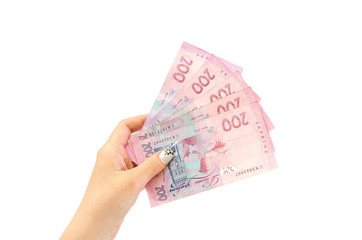 200 hryvnia in hand isolated on white background