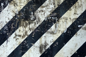 Black and White No Parking Striped Line on Old Concrete Wall Background.