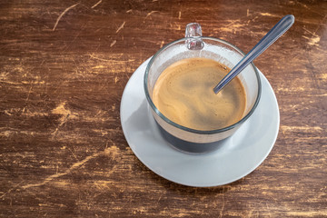 Cafe Cubano in in a glass mug on a wooden table