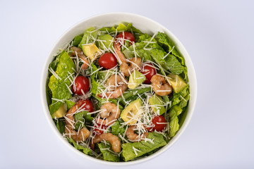 salad of shrimp and avocado, served in white bowl