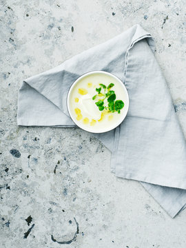 Soup on a stone background with napkin