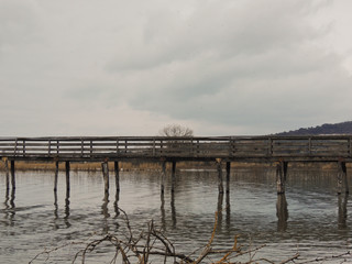 Wooden pier over the lake in Umbria, Italy.
