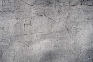 Old plaster with cracks and bumps