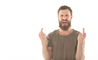 Naklejka premium Young angry handsome man Showing middle finger.