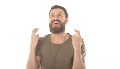 Fototapeta premium Handsome man with his fingers crossing