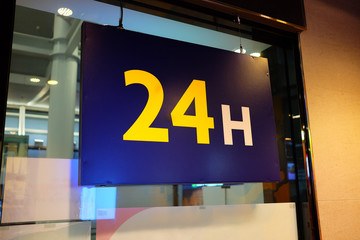 Twenty Four Hour Service Sign at the Fast Food Store.