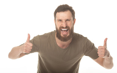 Fototapeta premium Portrait of a handsome young bearded man laughing