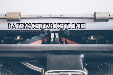 word DATENSCHUTZRICHTLINIE, German for privacy policy, written on vintage manual typewriter