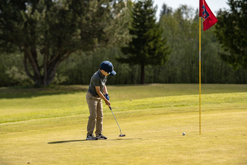 Junior Golfer Putting