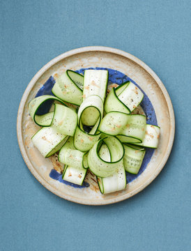 cucumbersalat on a blue ceramics patter