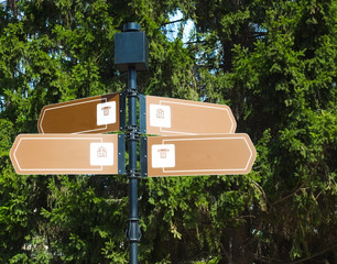signpost to places of interest,  4 directions, installed in the city park.  closeup