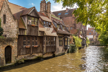 Fototapeta na wymiar Beautiful view of medieval architecture and canal near the Beguinage (Begijnhof) in Bruges (Brugge)