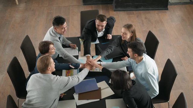 Great job! Successful business team is clapping their hands in modern office coworking, celebrating the performance of new product applause together success