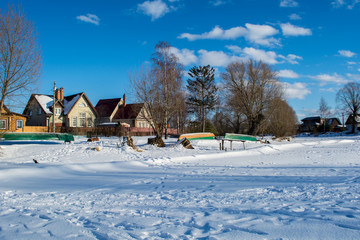Winter landscape village on a sunny day with blue sky