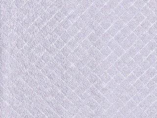 Texture of wool felt material. Soft cloth with pile, textiles rhombus. Background of rhombic felt fabric.