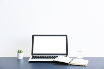 Fototapeta premium Flat lay on white wooden workspace with laptop computer, cell phone gadget, supplies, mini alarm clock & black coffee. Wood textured office desk. Deadline concept. Copy space, background, top view.