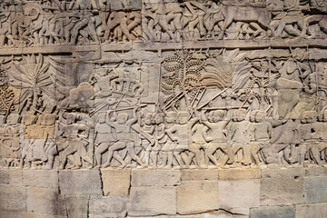 Fototapeta na wymiar Bas reliefs at Bayon temple depicting the battles between Khmers and their traditional enemies the Chams, Angkor Thom, Siem Reap, Cambodia